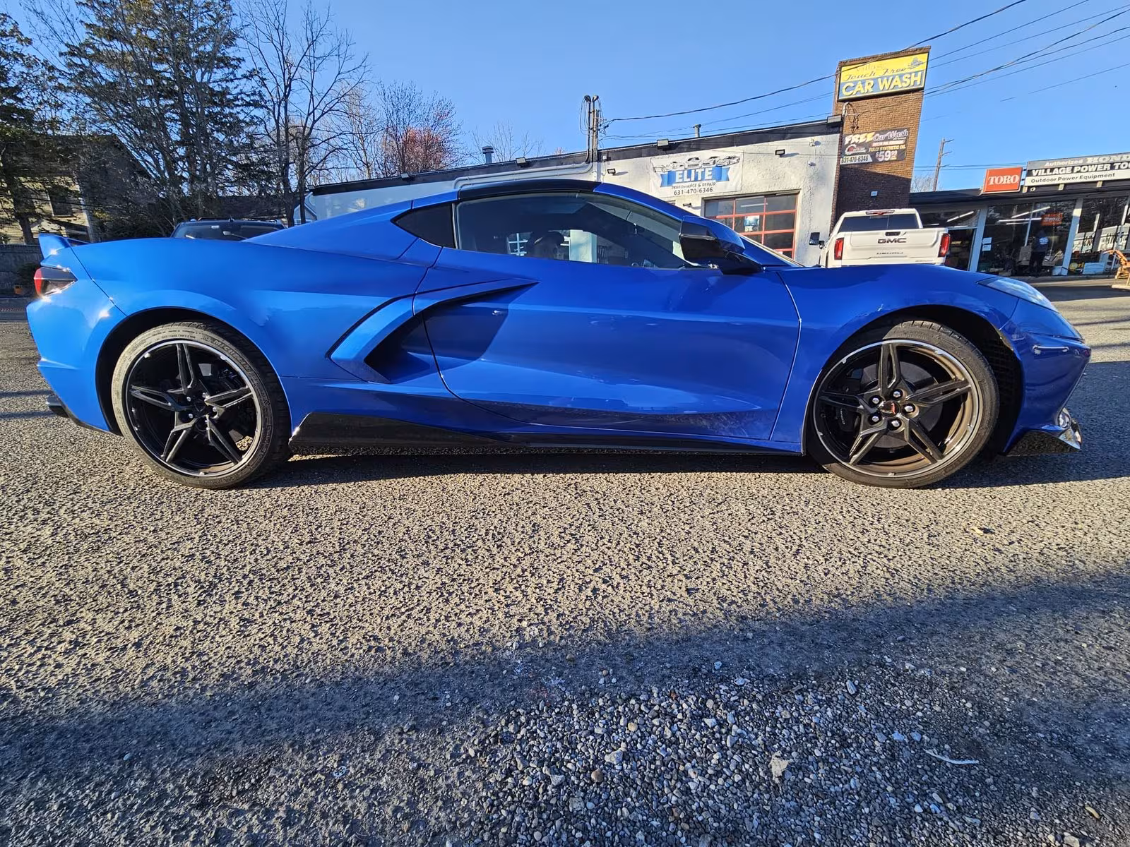 Blue Corvette outside the shop