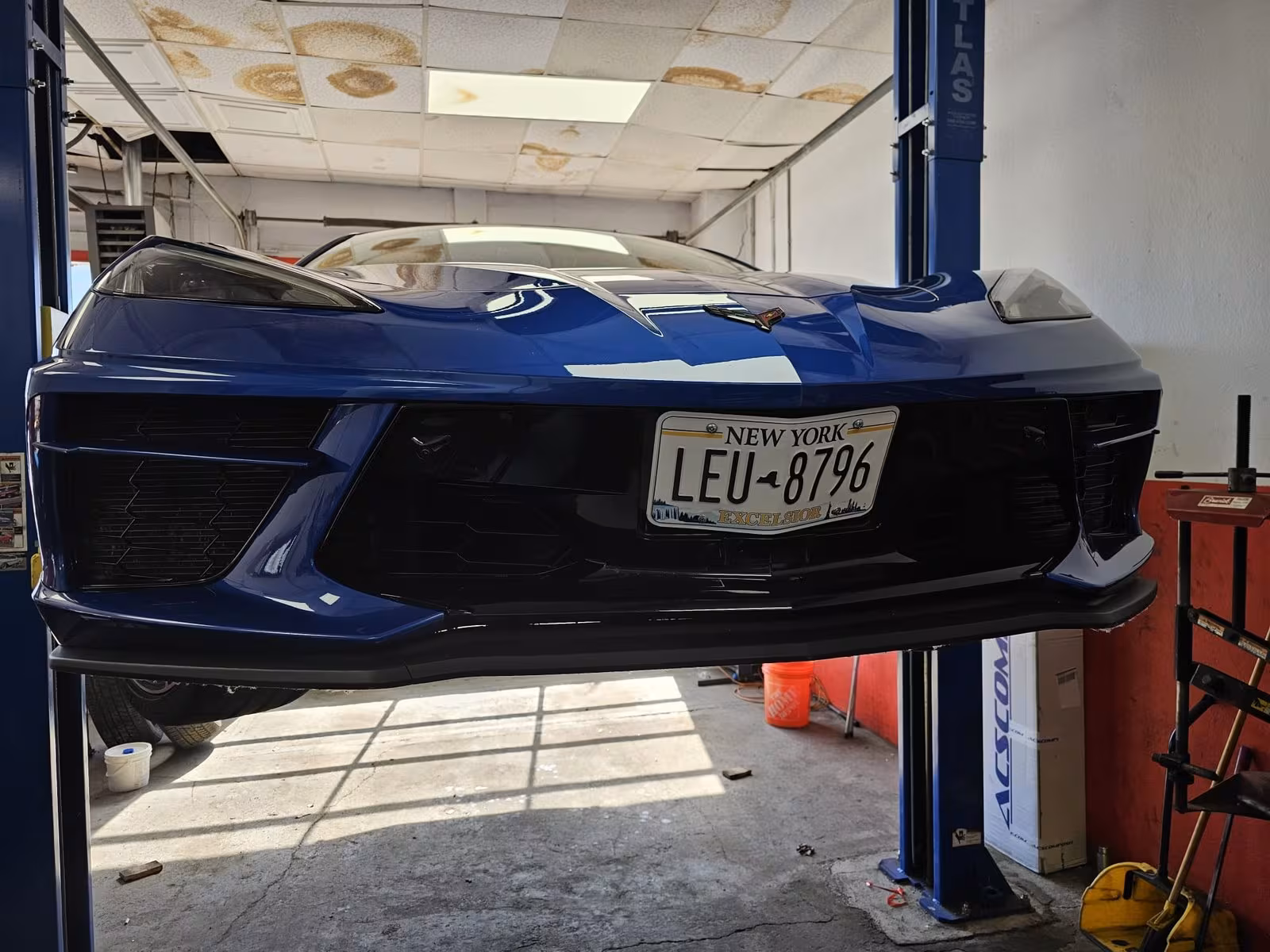 Chevrolet Corvette C8 on the lift at Elite Performance & Repair